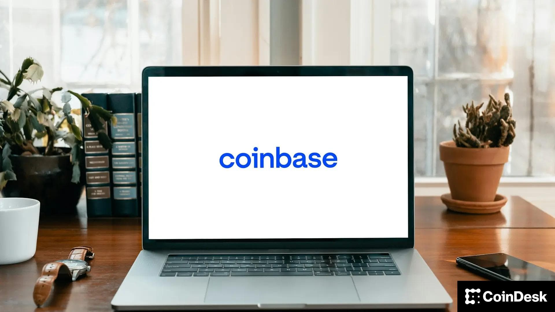 Coinbase logo shown on a laptop screen (Shutterstock)
