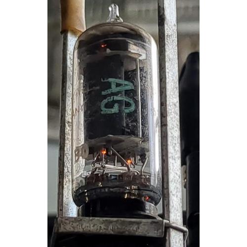 The tube powered up, showing the glowing filaments.