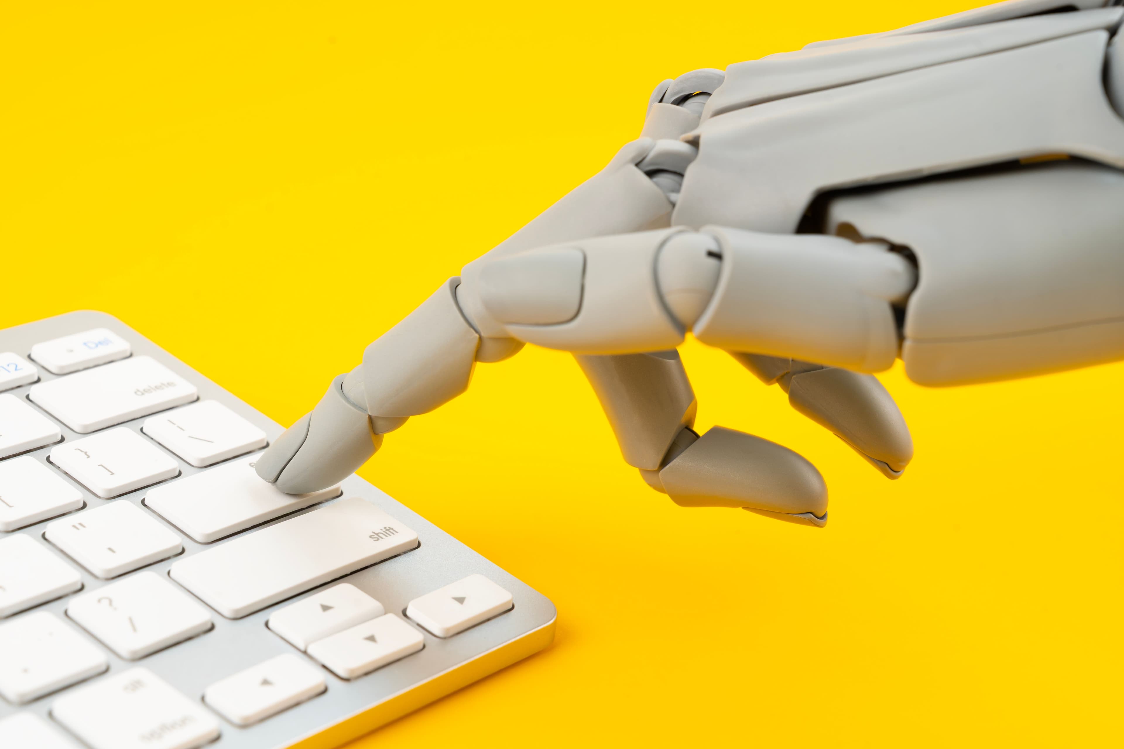 Robots hand on keyboard