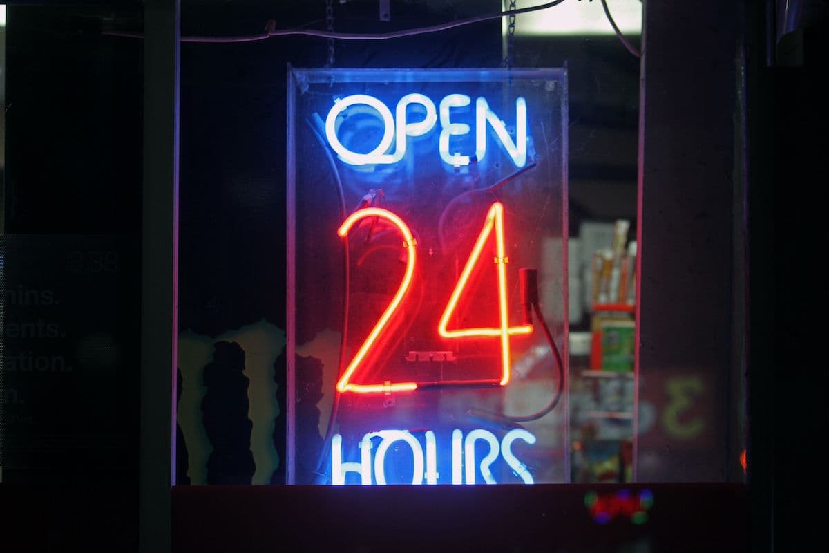 Neon sign saying 'Open 24 hours'