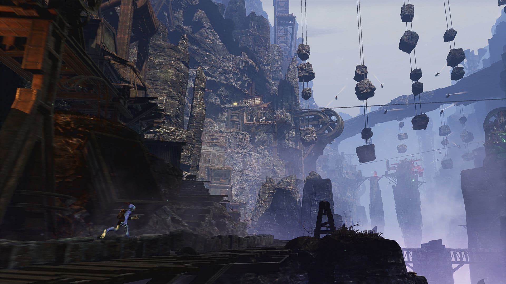 Taken from Oddworld Soulstorm game - Person running along a rocky mountainous type area. ahead of them are large stone bridges and large boxes hanging from wires