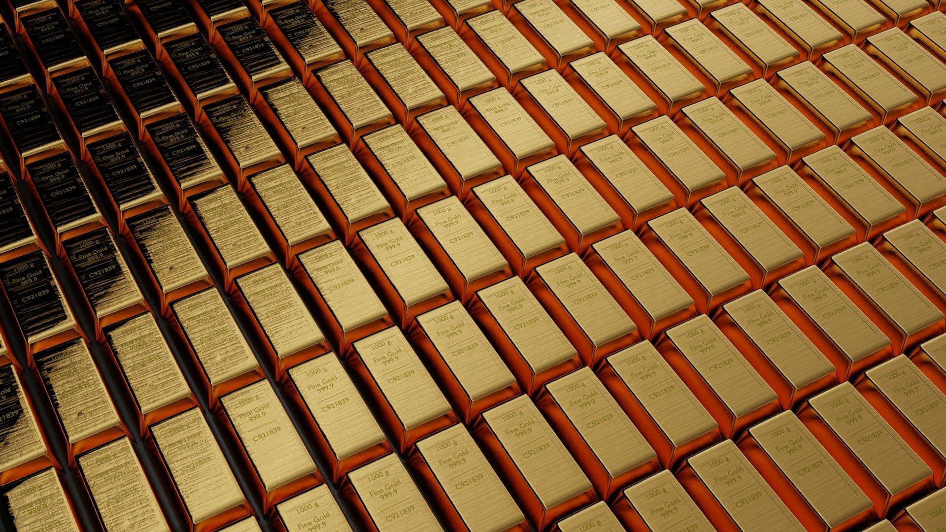 1 kg gold bars set out in ranks.