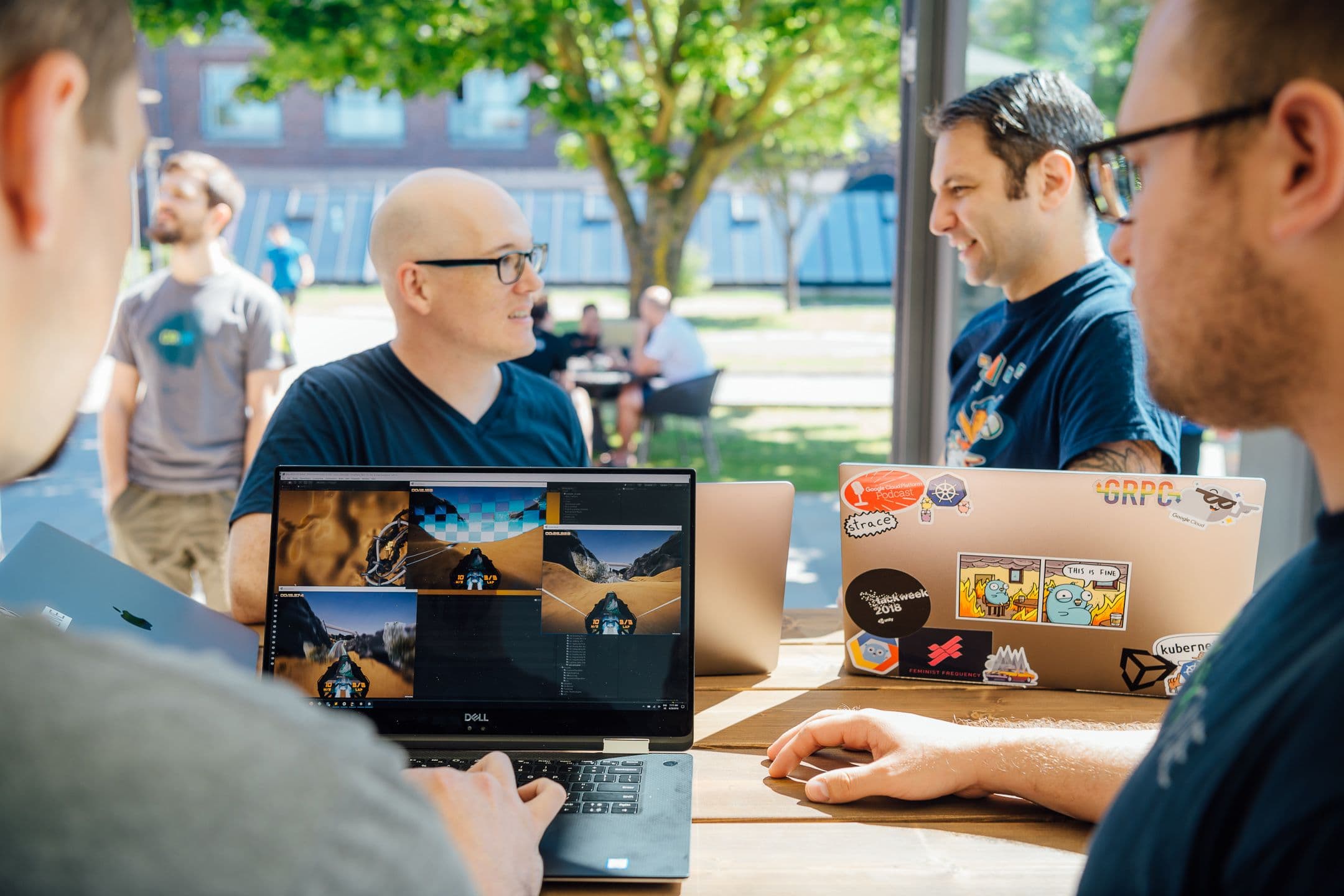 Image of people around a laptop