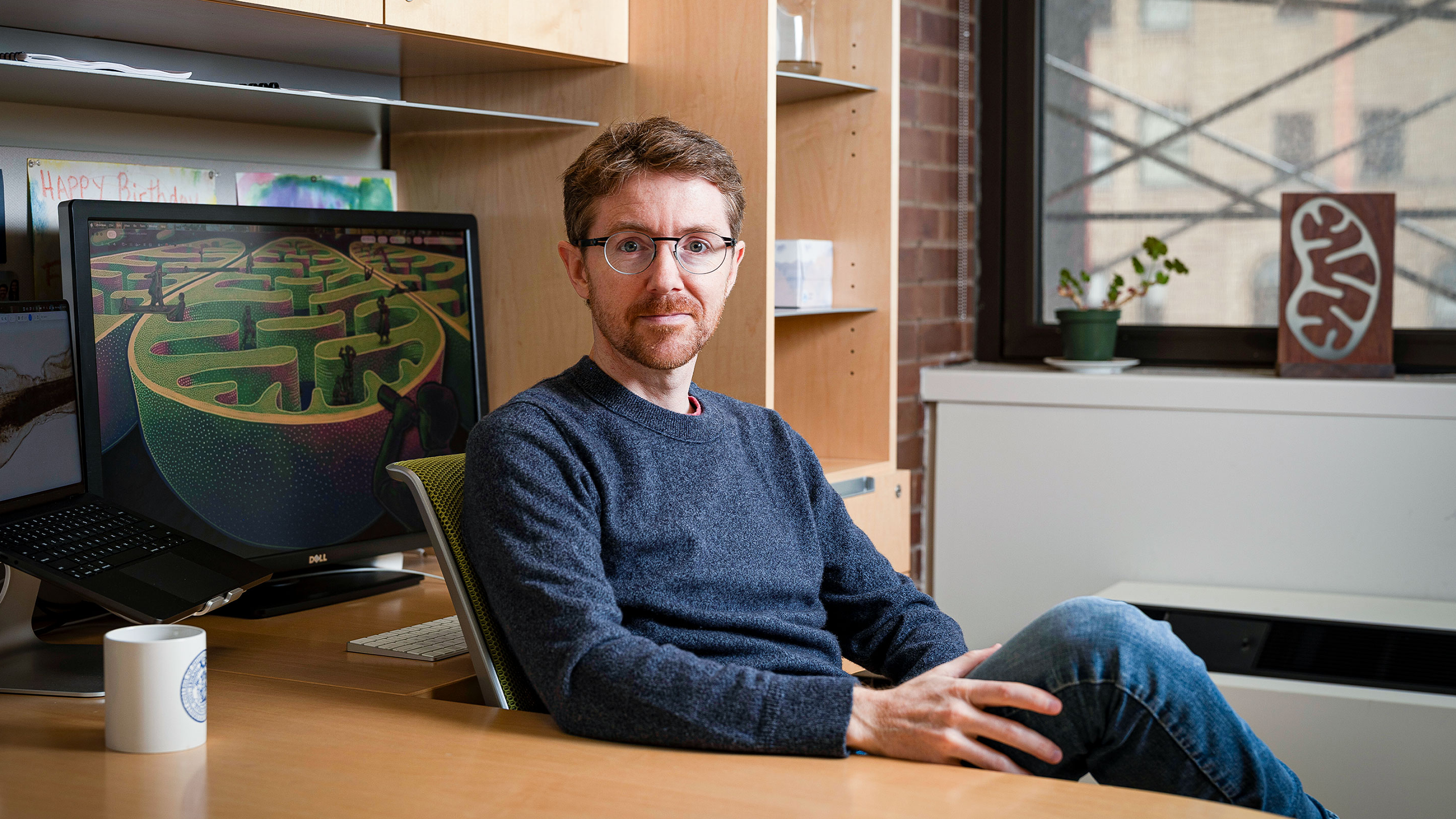 Martin Picard sits at his desk in his office.
