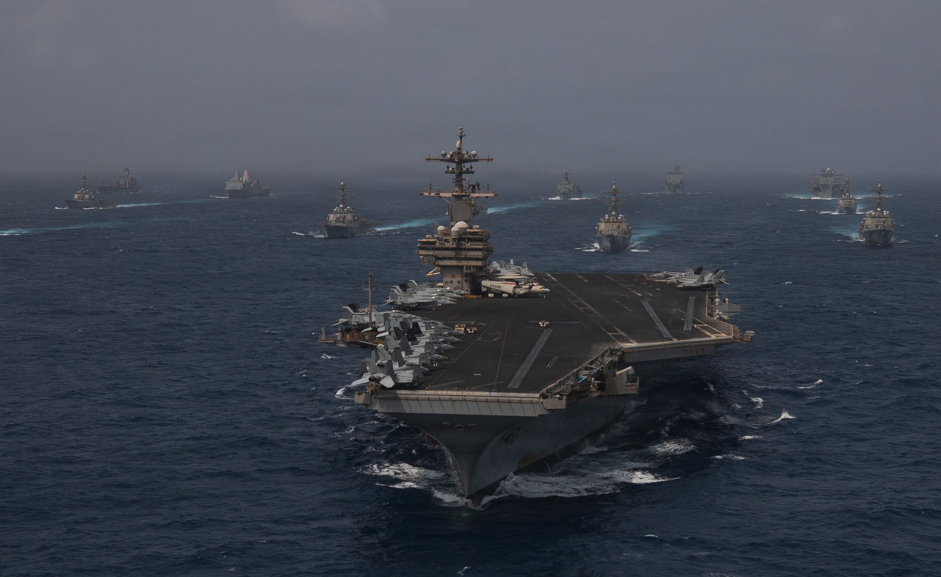 U.S. Navy warships transit the Arabian Sea in close formation.
