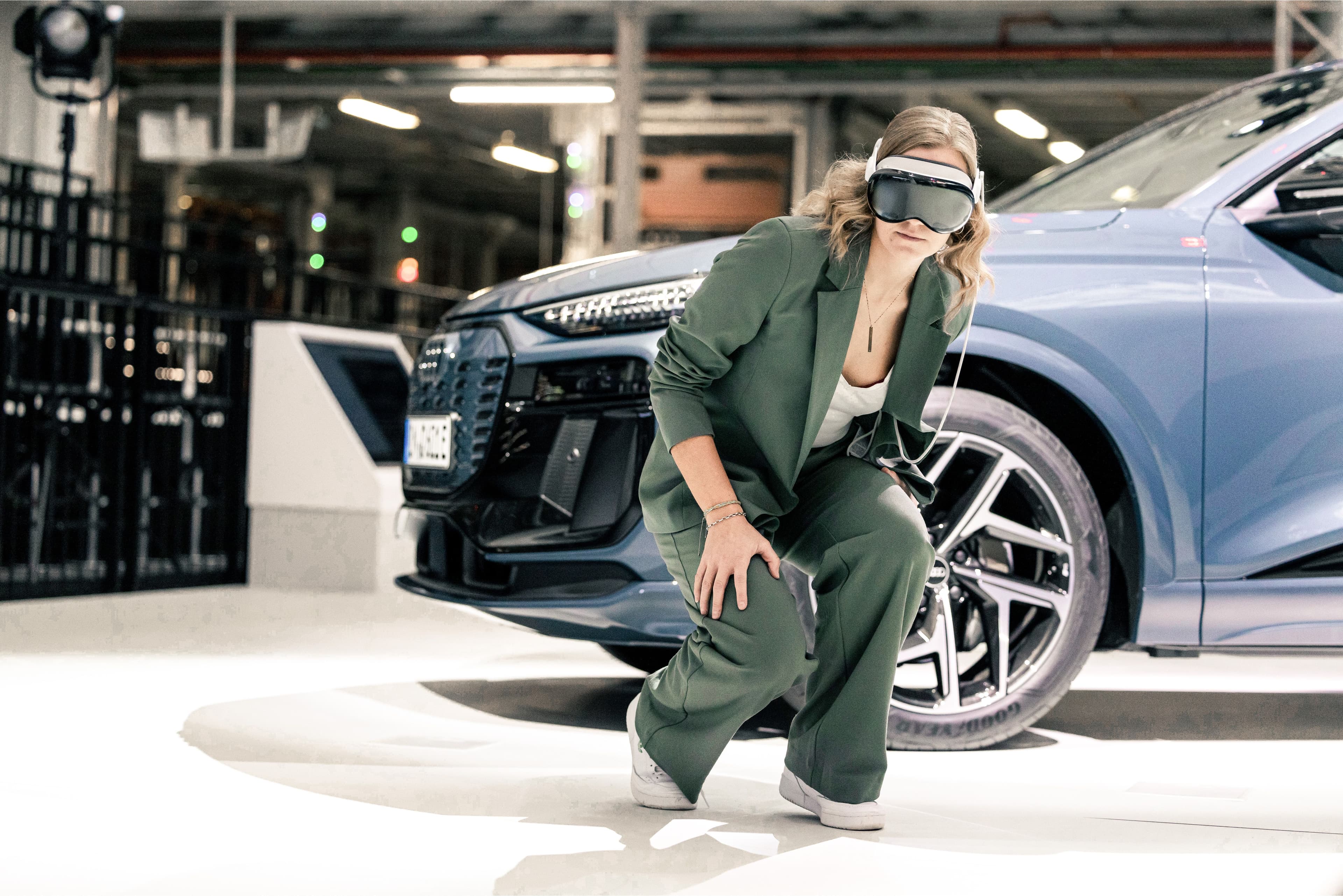 “Woman wearing AR/VR glasses for immersive Audi car driving”