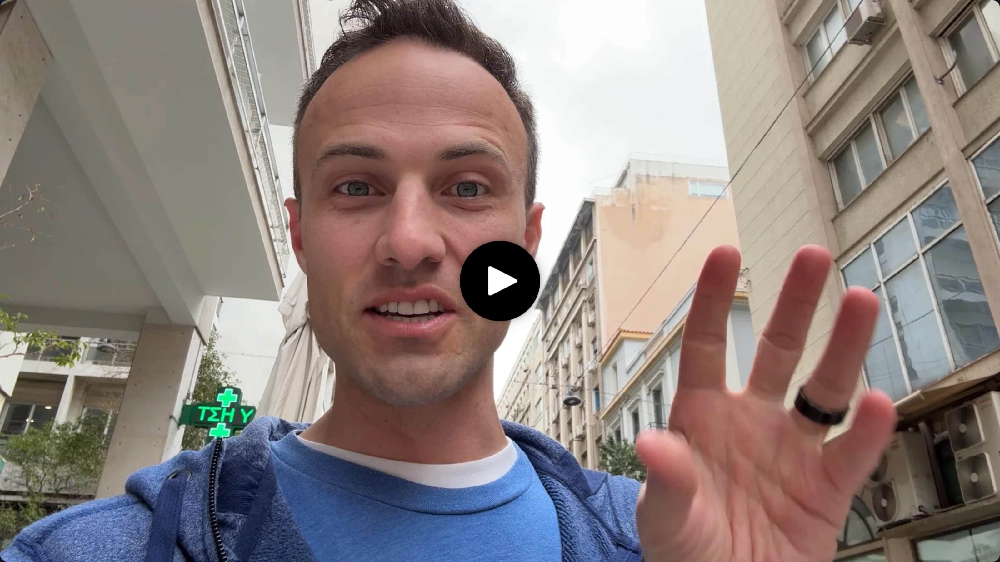 Kent waving at you with a play button over his face