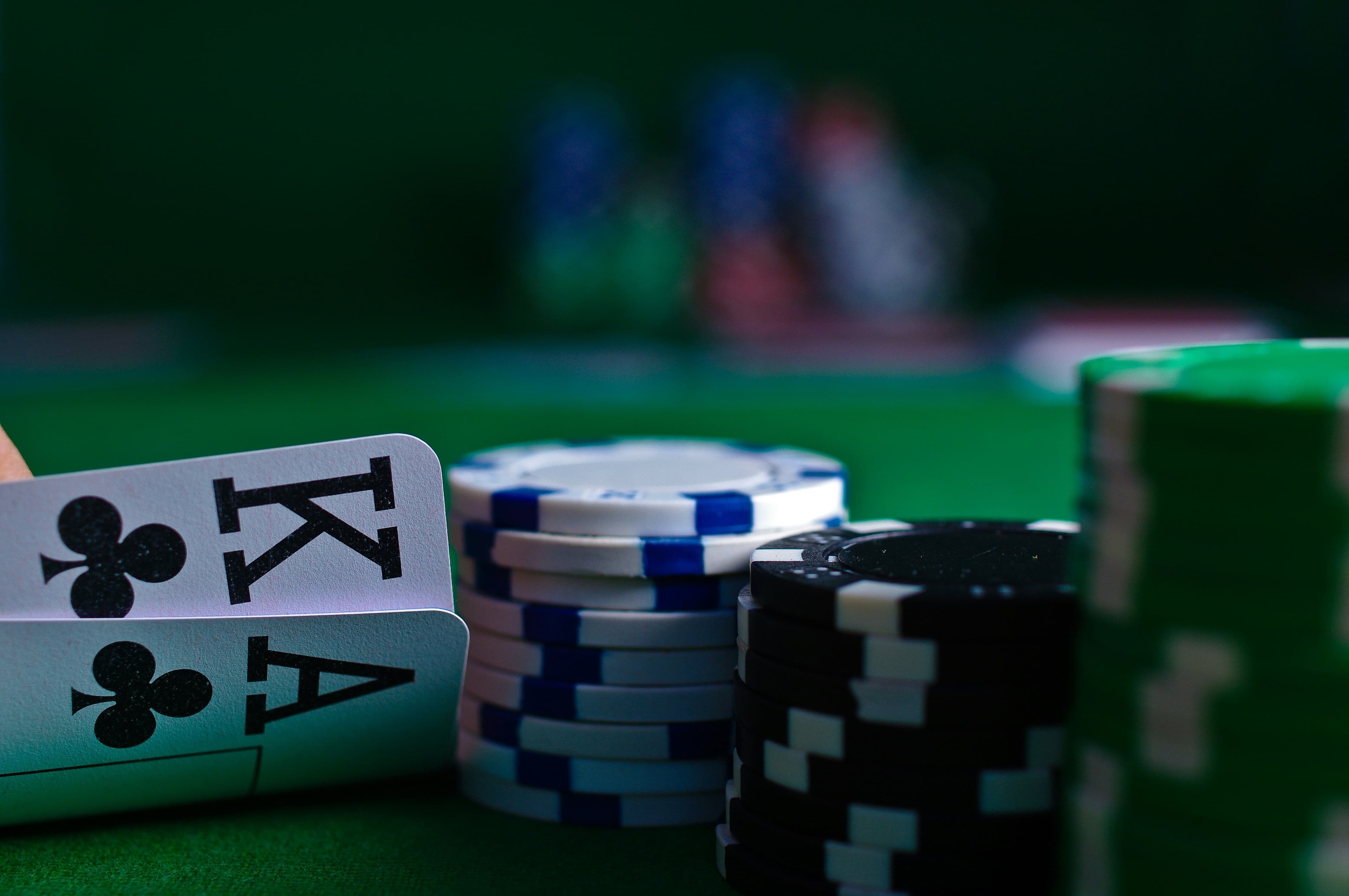 Playing cards and poker chips (Michal Parzuchowski/Unsplash)