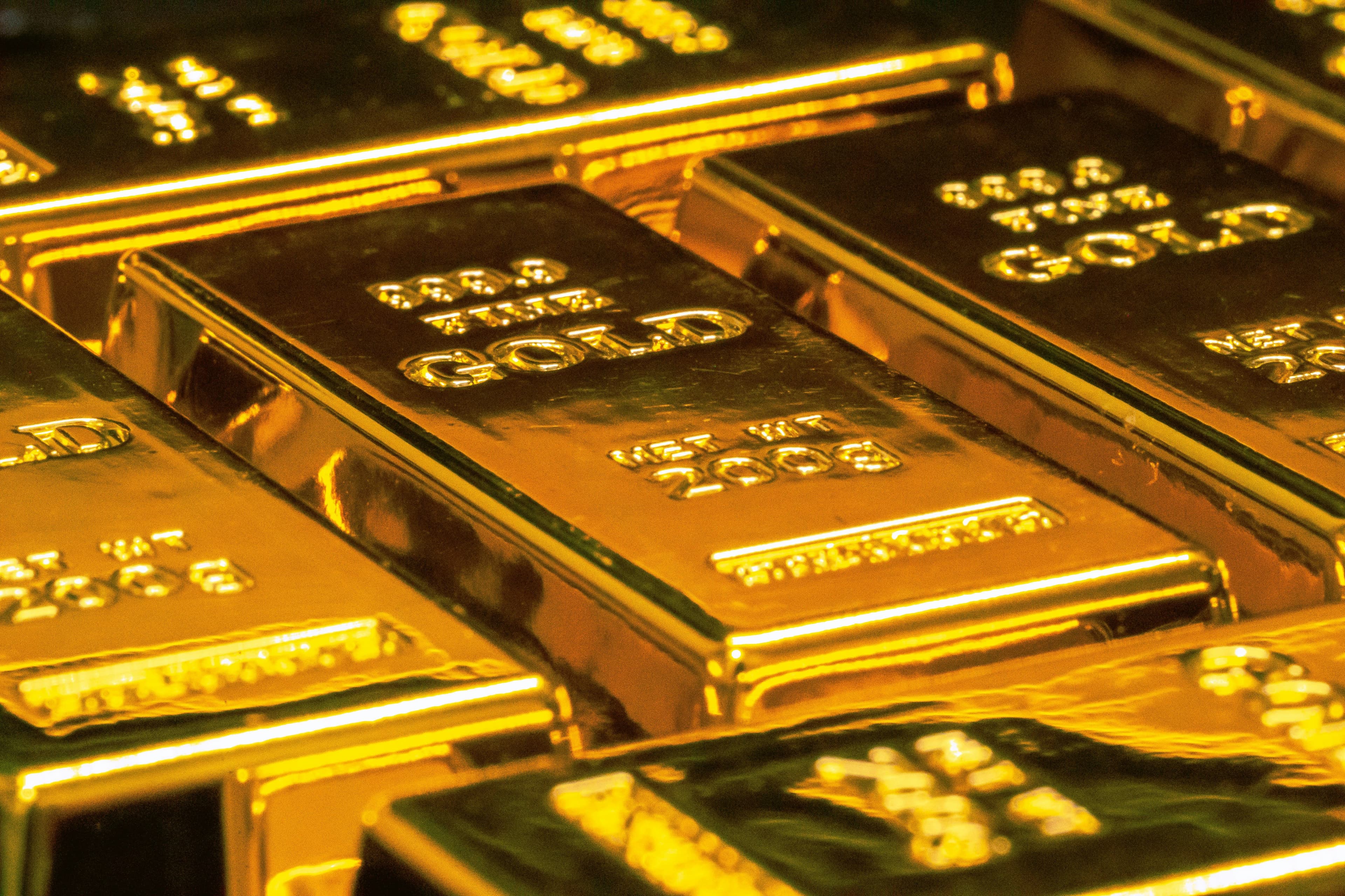 Close-up of stacked gold bars. (Jingming Pan/Unsplash)