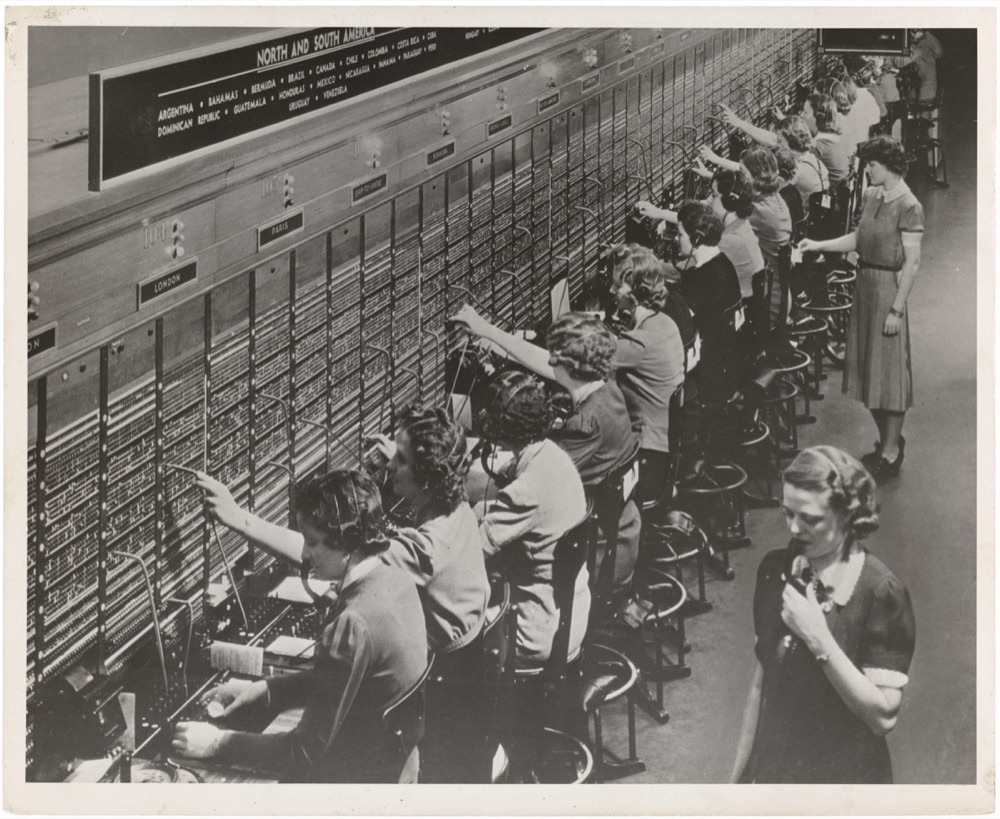 Women working at a Bell System international telephone switchboard, 1943