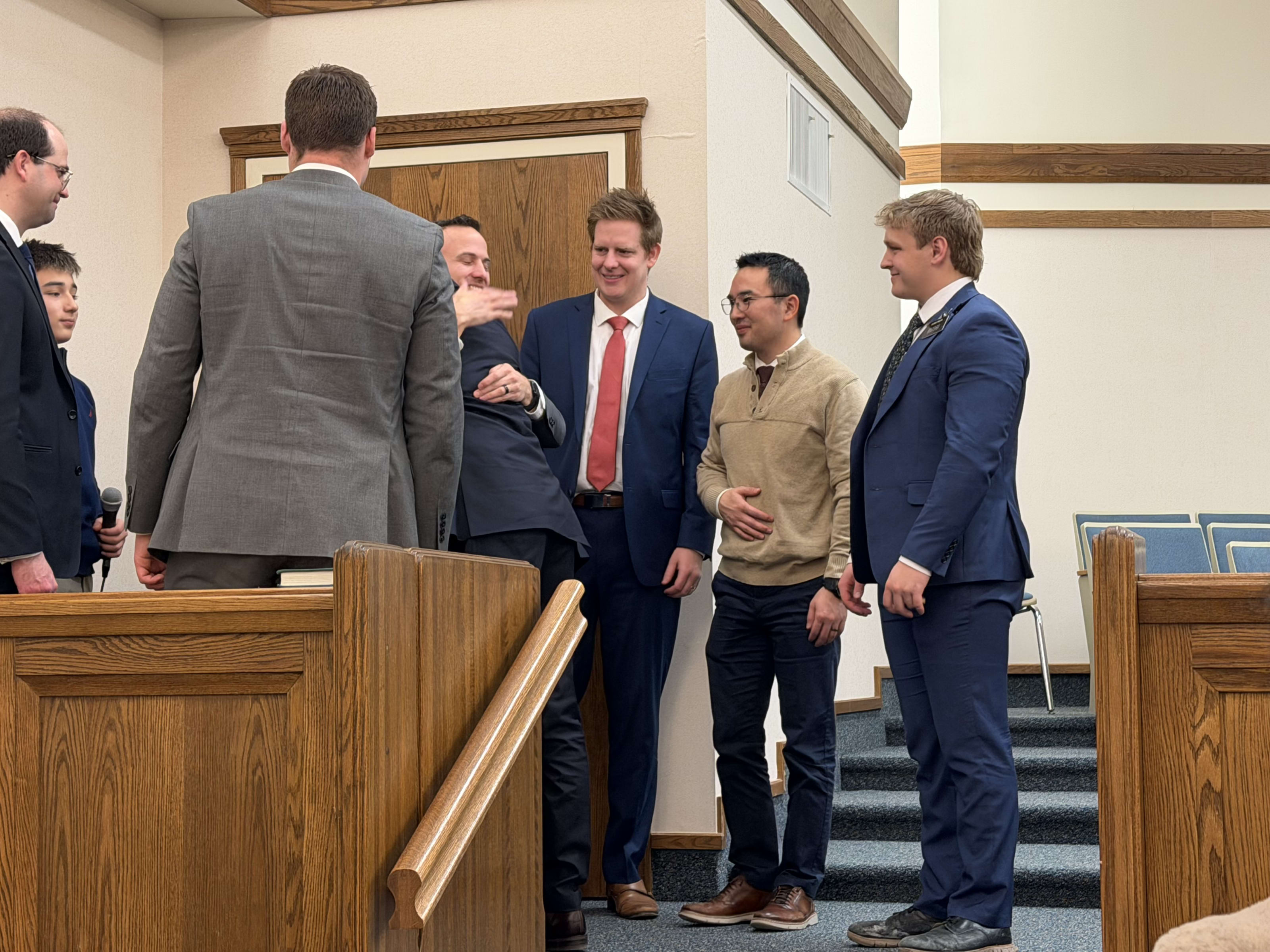 Jeremiah and Kent hugging after the confirmation
