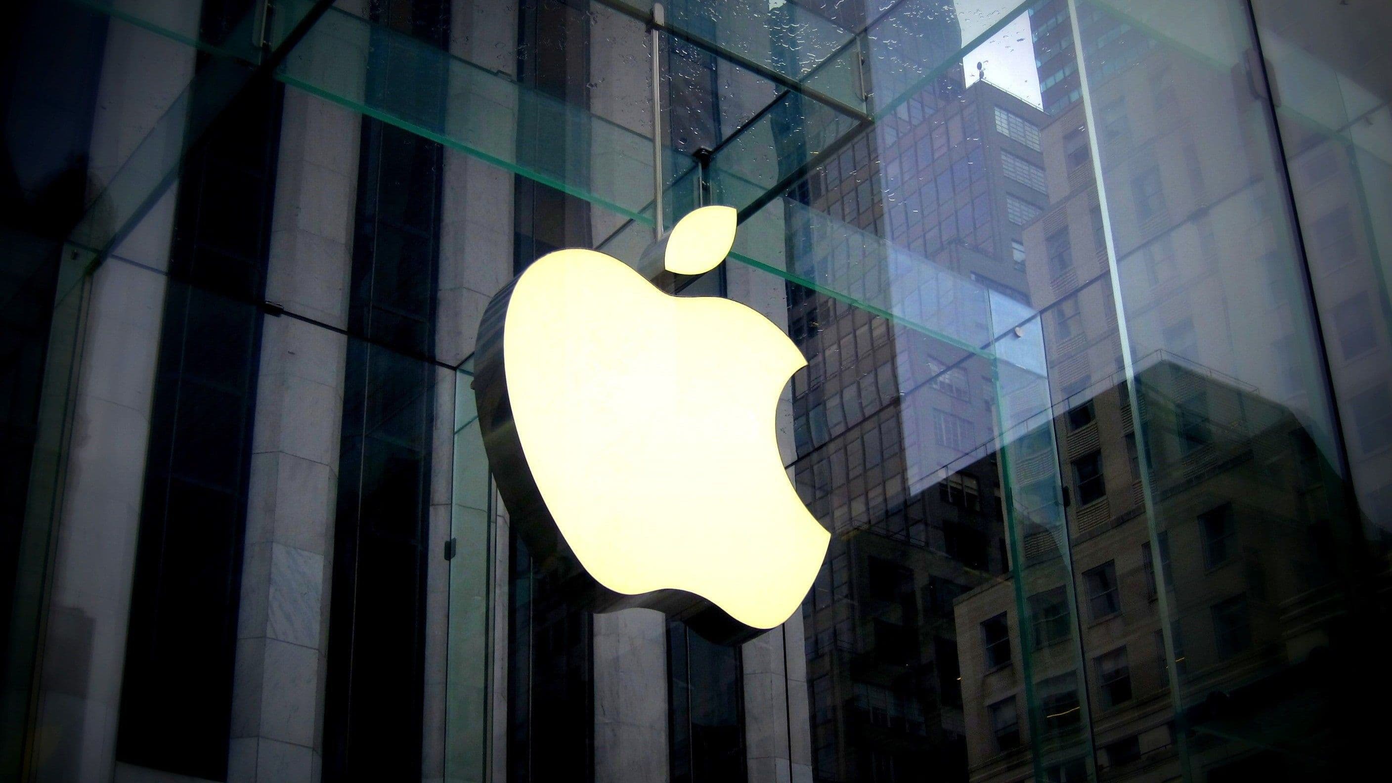 Apple logo on the side of a building.