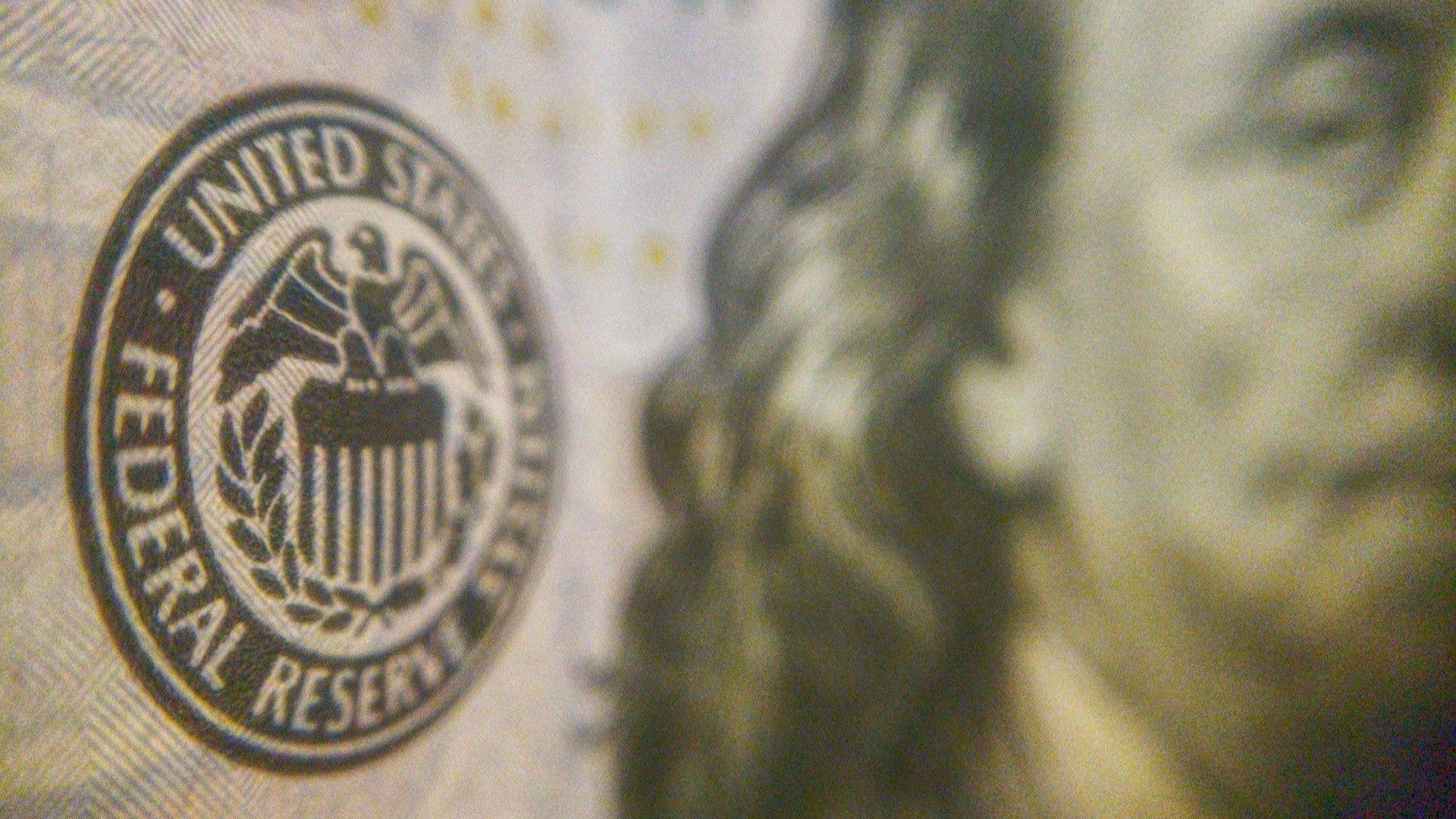 Federal Reserve logo highlighted on a U.S. banknote