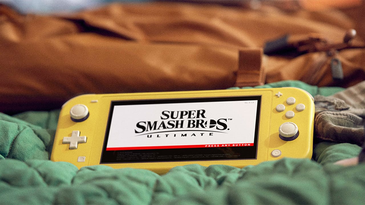 The Nintendo Switch lite, lying on a couch