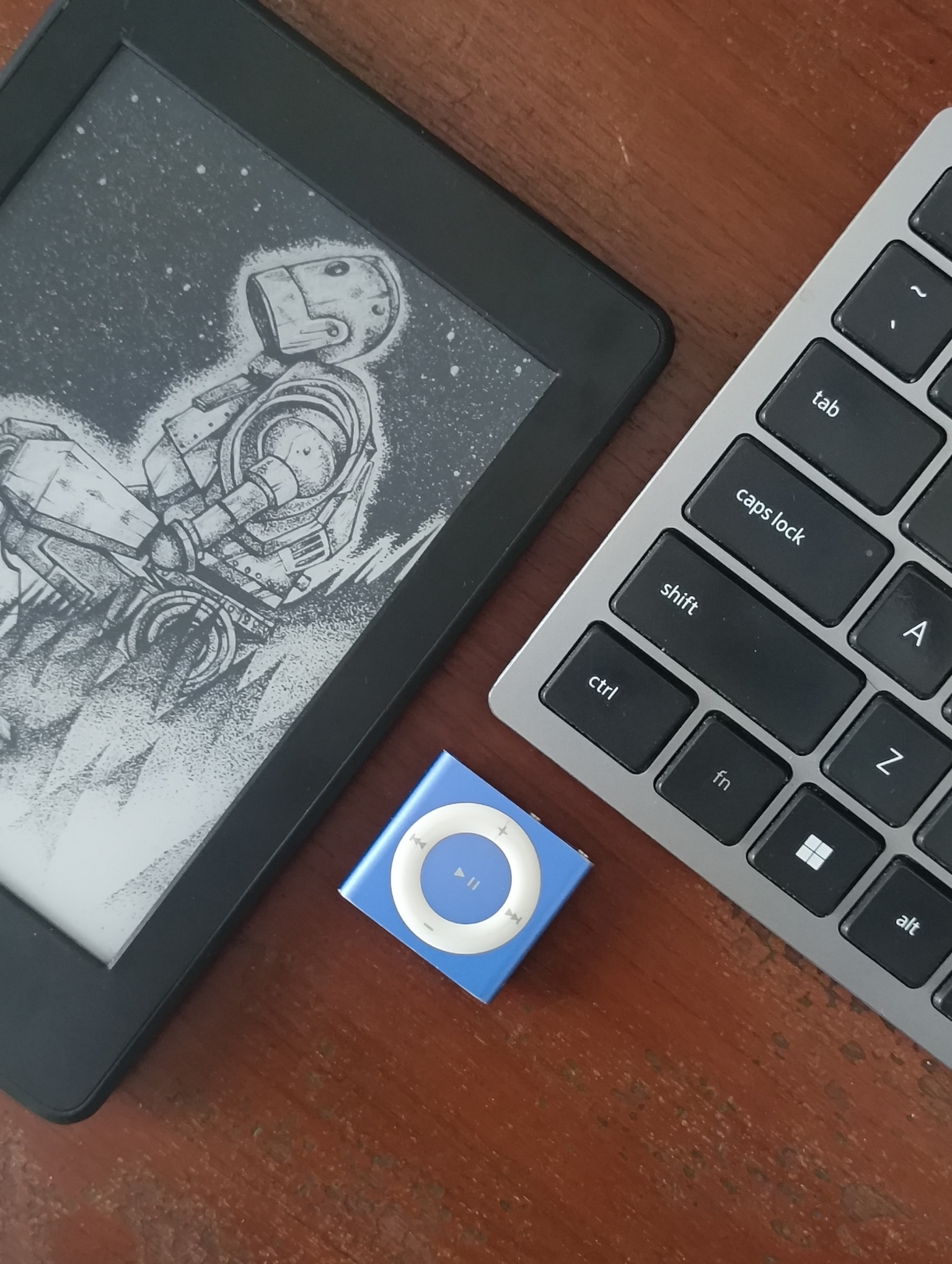 An image of happy times with my Kindle and iPod Shuffle.