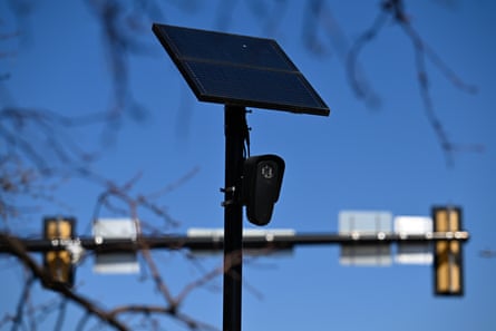 A surveillance camera at a traffic intersection.